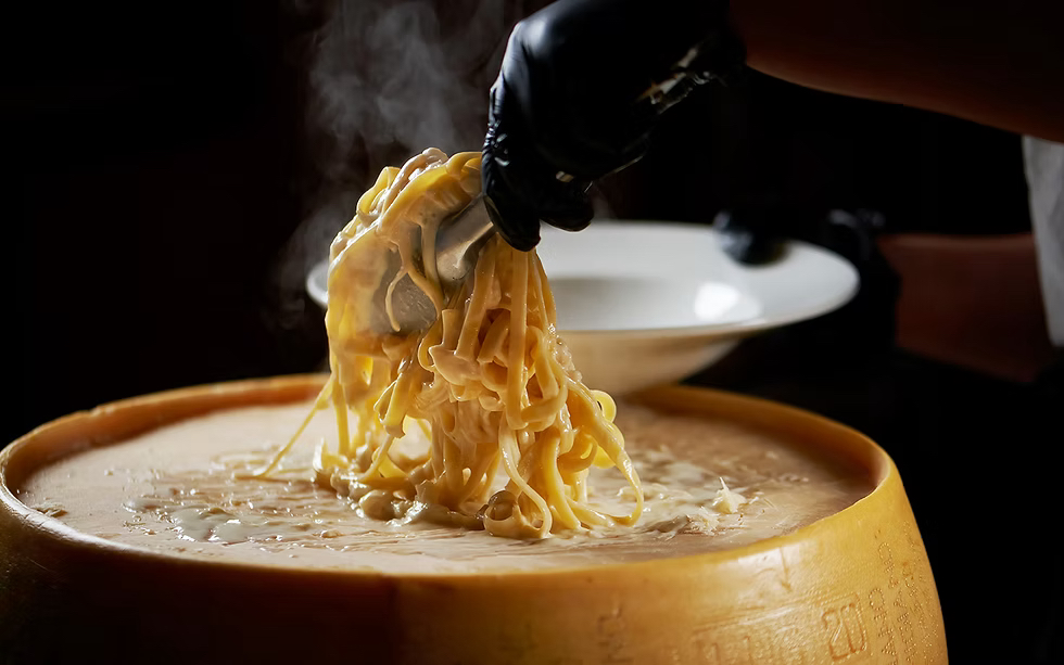 Our signature parmesan cheese wheel pasta